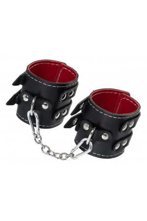 Черные кожаные наручники с двумя ремнями и красной подкладкой